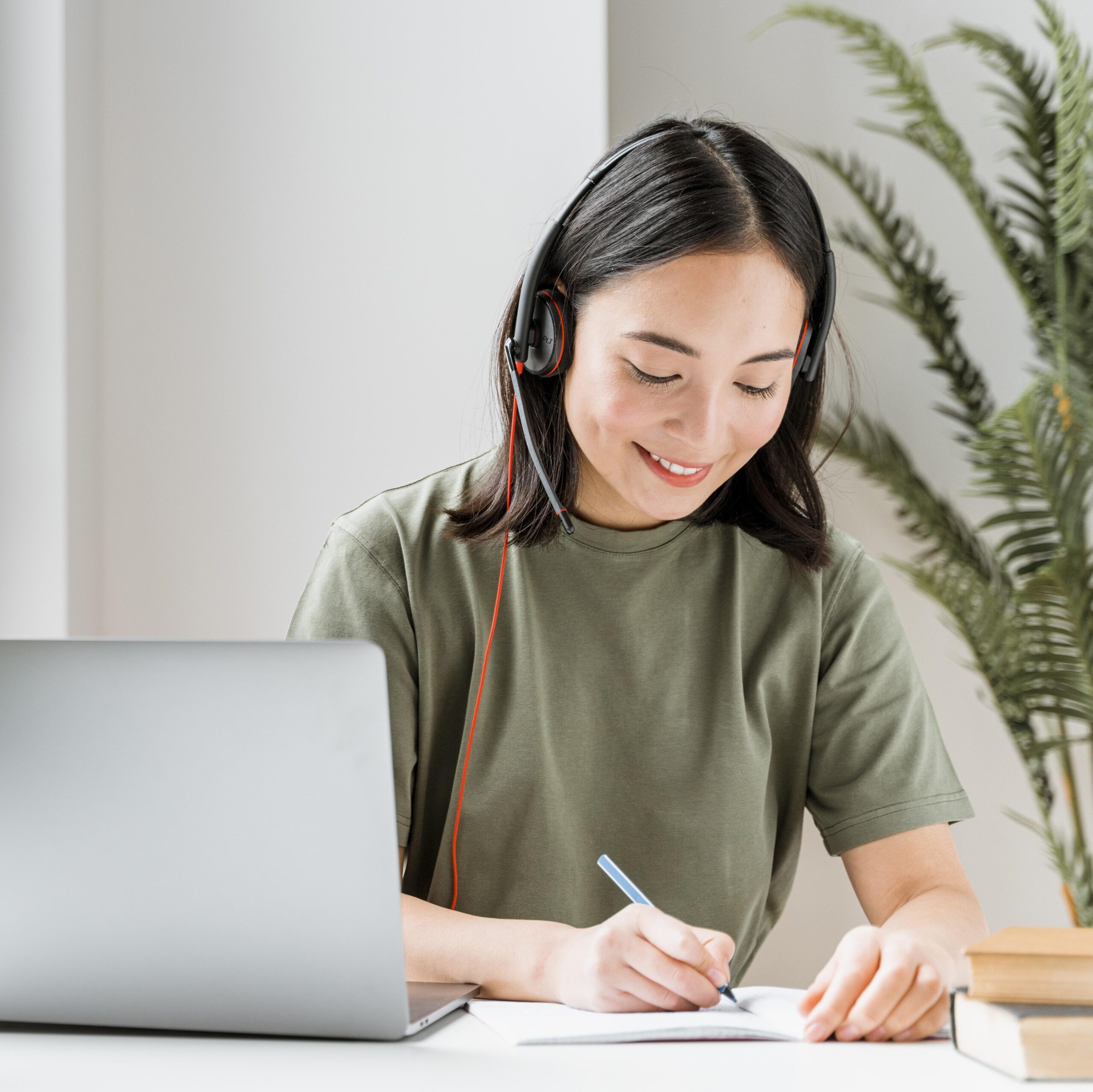 woman-with-headset-having-video-call-laptop woman-with-headset-having-video-call-laptop